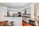 Modern kitchen with stainless steel appliances, granite countertops, and a breakfast bar at 513 Dragby Ln, Raleigh, NC 27603