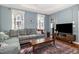 Comfortable living room with stylish decor, soft lighting, and a large sectional sofa at 513 Dragby Ln, Raleigh, NC 27603
