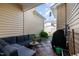 Cozy outdoor patio with comfortable seating and wood-look tile flooring at 513 Dragby Ln, Raleigh, NC 27603