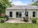 The backyard has a patio area with an outdoor dining set at 5801 Hadrian Dr, Durham, NC 27703