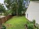 Spacious fenced backyard with garden beds at 5801 Hadrian Dr, Durham, NC 27703