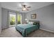 Bedroom with a ceiling fan, a window, and a bed with light green bedding at 5801 Hadrian Dr, Durham, NC 27703