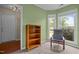 Sunroom with green walls, carpeted flooring, a ceiling fan, and an abundance of natural light at 5801 Hadrian Dr, Durham, NC 27703
