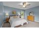 The carpeted bedroom includes a dresser, side tables, and a window with a backyard view at 5801 Hadrian Dr, Durham, NC 27703