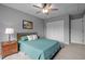 Cozy bedroom featuring neutral walls, carpet, a ceiling fan, and a window at 5801 Hadrian Dr, Durham, NC 27703