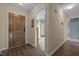 Inviting foyer with wood flooring and a view of a hallway leading to additional rooms at 5801 Hadrian Dr, Durham, NC 27703
