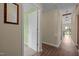 Hallway featuring wood flooring, neutral wall paint, and doorways to different rooms at 5801 Hadrian Dr, Durham, NC 27703
