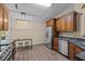 Bright eat-in kitchen featuring stainless steel appliances, wood floors and a skylight at 5801 Hadrian Dr, Durham, NC 27703