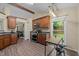 Spacious kitchen with stainless steel appliances, wood cabinets, and an eat-in breakfast table at 5801 Hadrian Dr, Durham, NC 27703