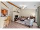 Comfortable living space featuring wood floors, wooden ceiling beams, and an open layout to the kitchen at 5801 Hadrian Dr, Durham, NC 27703