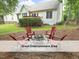 Backyard patio with fire pit and Adirondack chairs, ideal for outdoor gatherings and relaxation in a cozy setting at 603 Red Cedar Cir, Durham, NC 27712