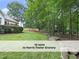 Well-manicured lawn and garden landscaping create a picturesque setting, enhancing the property's curb appeal and outdoor enjoyment at 603 Red Cedar Cir, Durham, NC 27712