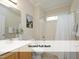 Second full bath features a shower and tub combo, single vanity, and toilet at 603 Red Cedar Cir, Durham, NC 27712
