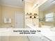 Bright bathroom showcasing a dual sink vanity, a soaker tub, and a separate shower stall at 603 Red Cedar Cir, Durham, NC 27712