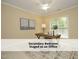 Bedroom staged as an office featuring a ceiling fan and natural lighting at 603 Red Cedar Cir, Durham, NC 27712