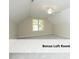 A carpeted bonus room offers great natural sunlight and a ceiling fan at 603 Red Cedar Cir, Durham, NC 27712