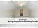 Unfinished bonus room with vaulted ceiling, ceiling fan, and recessed lighting, ideal for customization and added value at 603 Red Cedar Cir, Durham, NC 27712