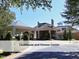 Clubhouse and fitness center with attractive porte-cochere entrance, stone facade, and well-maintained landscaping at 603 Red Cedar Cir, Durham, NC 27712