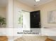 Inviting foyer with hardwood floors and a view of the bright entrance at 603 Red Cedar Cir, Durham, NC 27712