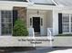 Close-up of the front porch with stone accents and a black front door at 603 Red Cedar Cir, Durham, NC 27712