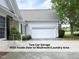 Two-car attached garage with a driveway, close to front entrance at 603 Red Cedar Cir, Durham, NC 27712