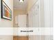A hallway with beautiful hardwood floors, doors, and wall art at 603 Red Cedar Cir, Durham, NC 27712