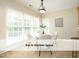 Eat-in kitchen featuring a modern table and chairs near window at 603 Red Cedar Cir, Durham, NC 27712