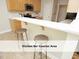 Open kitchen features a bar counter with bar stool seating and modern finishes at 603 Red Cedar Cir, Durham, NC 27712