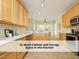 Bright kitchen featuring plentiful cabinet storage, stainless appliances, and tile floors at 603 Red Cedar Cir, Durham, NC 27712