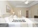 Relaxing primary suite with a decorative ceiling fan and private en suite bathroom at 603 Red Cedar Cir, Durham, NC 27712