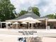 Enjoy the sunshine at the bar near the pool with outdoor seating and beautiful landscaping at 603 Red Cedar Cir, Durham, NC 27712