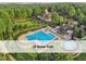 Aerial view of community pool area showcasing the 25-meter pool, pool and outdoor lounge areas at 603 Red Cedar Cir, Durham, NC 27712