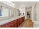 Bathroom with double sink vanity, tile floor, and walk-in closet at 610 Mixboro Dr, Cary, NC 27519