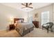 Comfortable bedroom with neutral decor and ceiling fan at 610 Mixboro Dr, Cary, NC 27519