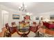 Spacious dining area featuring a glass table, hardwood floors, and an open layout at 610 Mixboro Dr, Cary, NC 27519