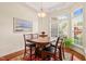 Bright dining room with a table that seats four, a patterned area rug, and natural light at 610 Mixboro Dr, Cary, NC 27519