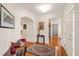 Welcoming foyer featuring hardwood floors, an arched doorway, and decorative wall trim at 610 Mixboro Dr, Cary, NC 27519