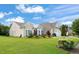 Charming home showcasing a well-manicured front yard, complementing the home's elegant exterior design at 610 Mixboro Dr, Cary, NC 27519