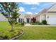 Attractive single-story house with a well-maintained lawn, garden, and a welcoming entrance at 610 Mixboro Dr, Cary, NC 27519