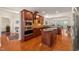 Modern kitchen with stainless steel appliances, island with breakfast bar, and hardwood floors at 610 Mixboro Dr, Cary, NC 27519