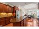 Gourmet kitchen with center island, stainless steel appliances, and hardwood floors at 610 Mixboro Dr, Cary, NC 27519