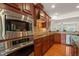 Gourmet kitchen features stainless steel appliances and custom cabinetry at 610 Mixboro Dr, Cary, NC 27519