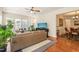 Bright living room featuring a comfortable leather sofa, hardwood floors and lots of natural light at 610 Mixboro Dr, Cary, NC 27519