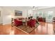 Comfortable living room with a fireplace, hardwood floors, and large windows for natural light at 610 Mixboro Dr, Cary, NC 27519