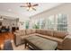 Spacious living room with fireplace, hardwood floors, and comfortable leather sectional sofa at 610 Mixboro Dr, Cary, NC 27519