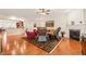 Bright living room featuring hardwood floors, a fireplace, and an open floor plan at 610 Mixboro Dr, Cary, NC 27519