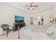 Relaxing main bedroom with TV, ensuite bath, and natural light, great for unwinding at 610 Mixboro Dr, Cary, NC 27519