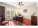 Inviting home office with natural light, ceiling fan, and hardwood floors at 610 Mixboro Dr, Cary, NC 27519