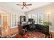 Well-lit home office with hardwood floors, neutral walls, and a ceiling fan at 610 Mixboro Dr, Cary, NC 27519