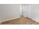 This bedroom features beautiful laminate flooring, white walls, and a large closet at 6129 Krandon Dr, Raleigh, NC 27603